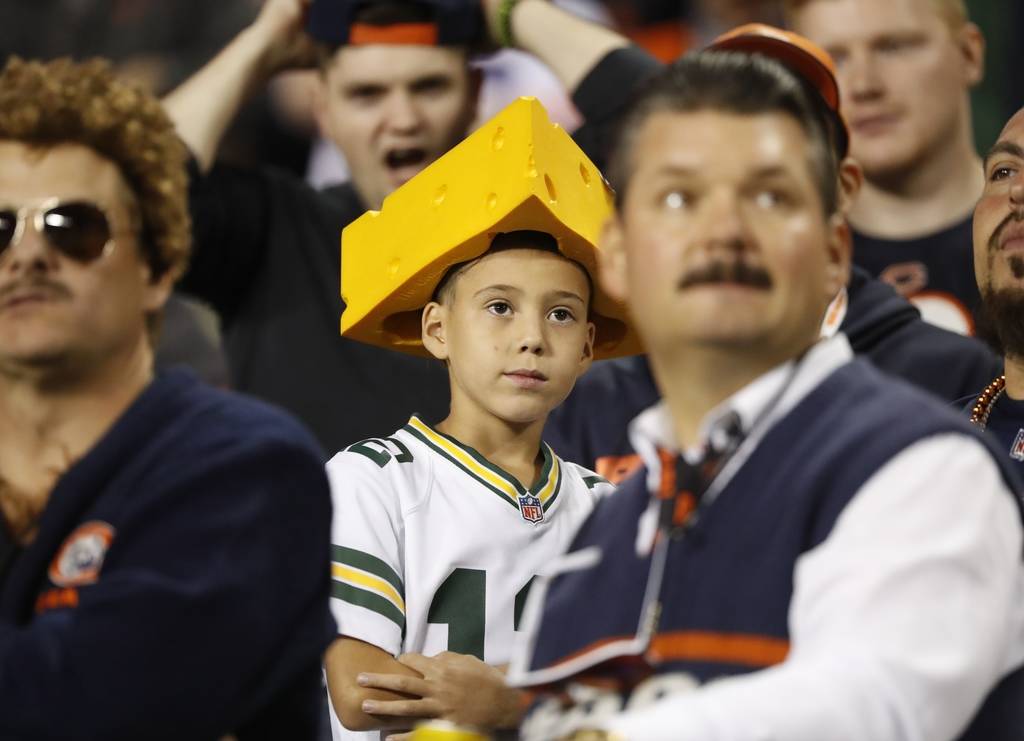 A fan watches during the first half of an NFL football game between the Green Bay Packers and t ...