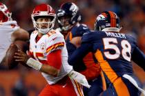Kansas City Chiefs quarterback Patrick Mahomes (15) scrambles as Denver Broncos linebacker Von ...