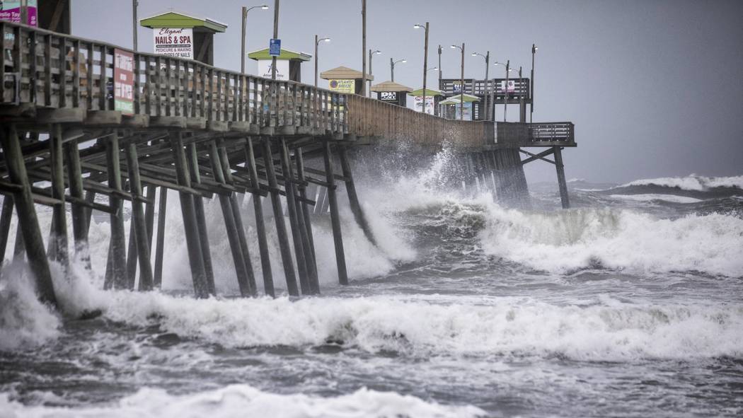 Waves pound the Bogue Inlet Fishing Pier in Emerald Isle, N.C.,as Hurricane Dorian moves north ...