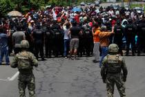 In a June 5, 2019, file photo, Mexican authorities stop a migrant caravan that had earlier cros ...