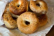 Variety of Authentic New York style bagels with seeds in a paper bag. (Getty Images)