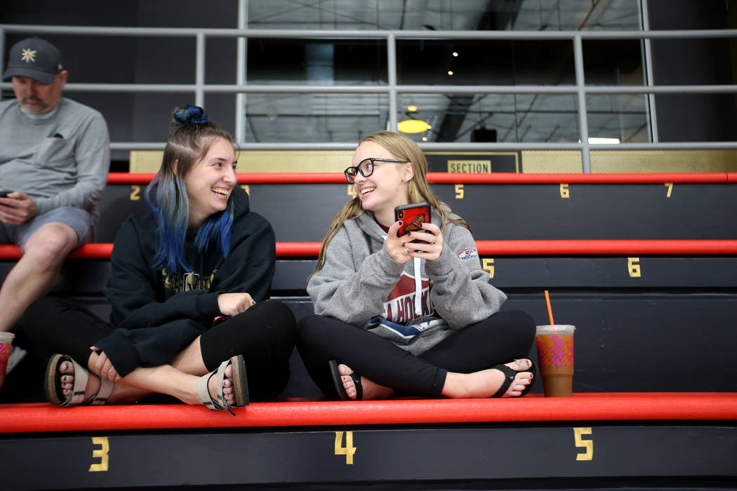Fans Clarissa Kirby, 18, left, and Siobhan Bauman, 19, both of Las Vegas wait for players to ta ...