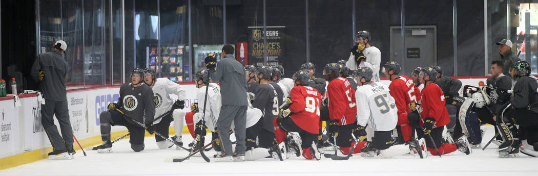 Vegas Golden Knights players take instruction on the first day of rookie camp at City National ...