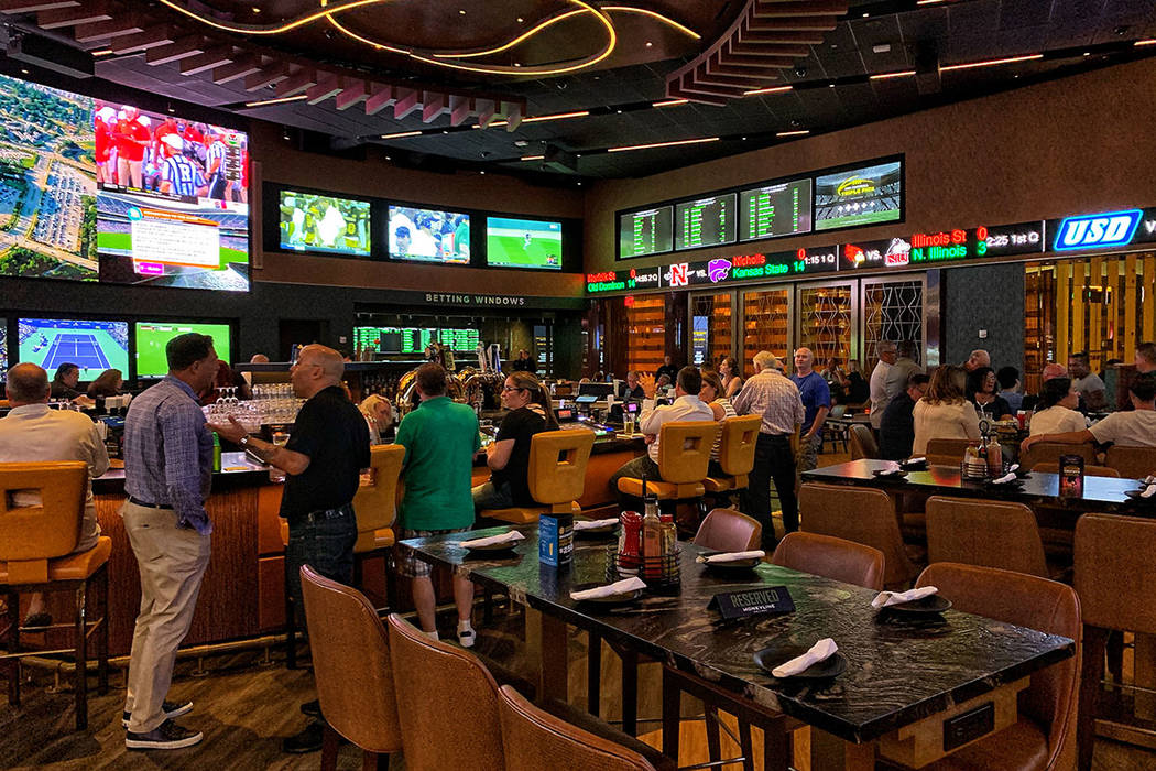 The Borgata's 8,000-square-foot Moneyline Bar and Book features a 35-foot-long circular bar wit ...