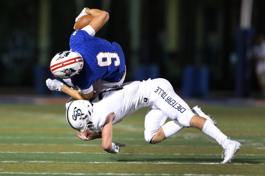 Lberty's Moliki Matavao (9) is tackled by St. John Bosco's Jake Newman (7) during the second qu ...
