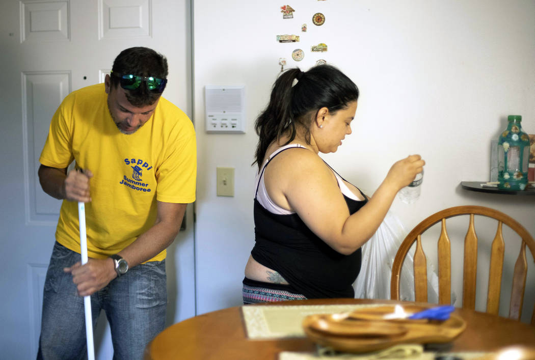 In this Aug. 2, 2019 photo, Ashlyn Gonzales, right, and her longtime partner Emanuel Rivera cle ...