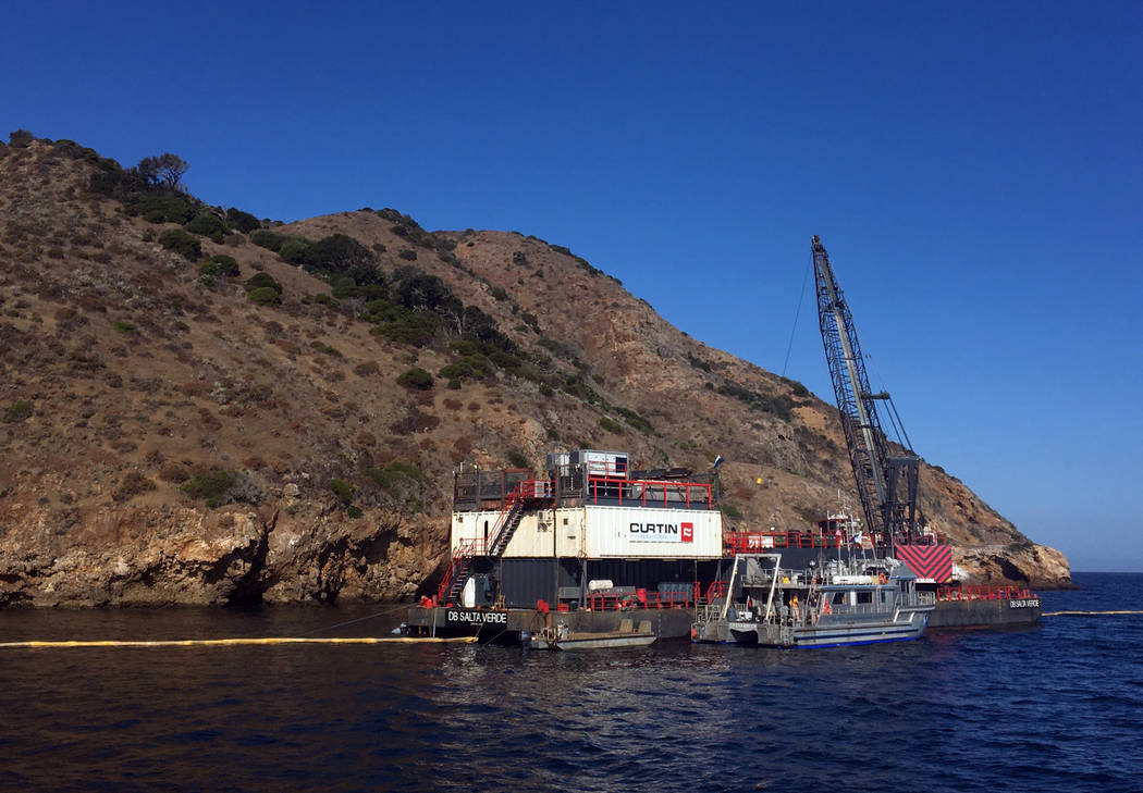 This photo provided by the U.S. Coast Guard shows the derrick barge Salta Verde engaged in salv ...