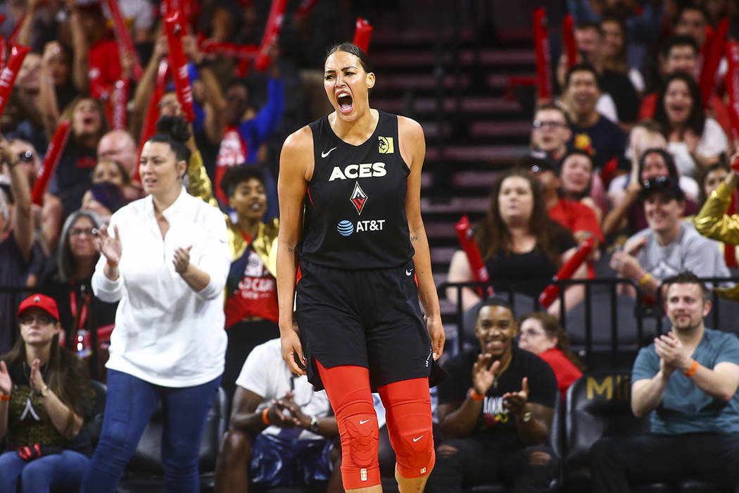 Las Vegas Aces' Liz Cambage celebrates during the second half of a WNBA basketball game against ...