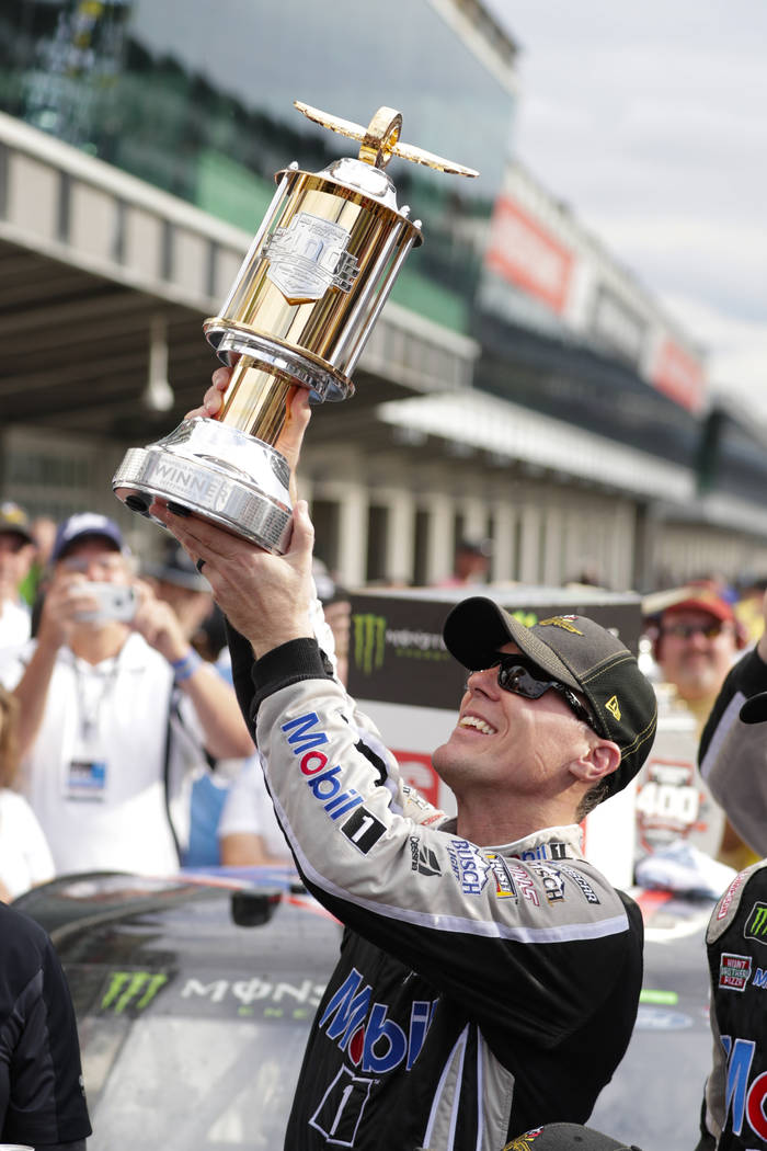 Kevin Harvick celebrates after winning the NASCAR Brickyard 400 auto race at Indianapolis Motor ...