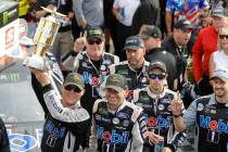 Kevin Harvick, left, celebrates after winning the NASCAR Brickyard 400 auto race at Indianapoli ...