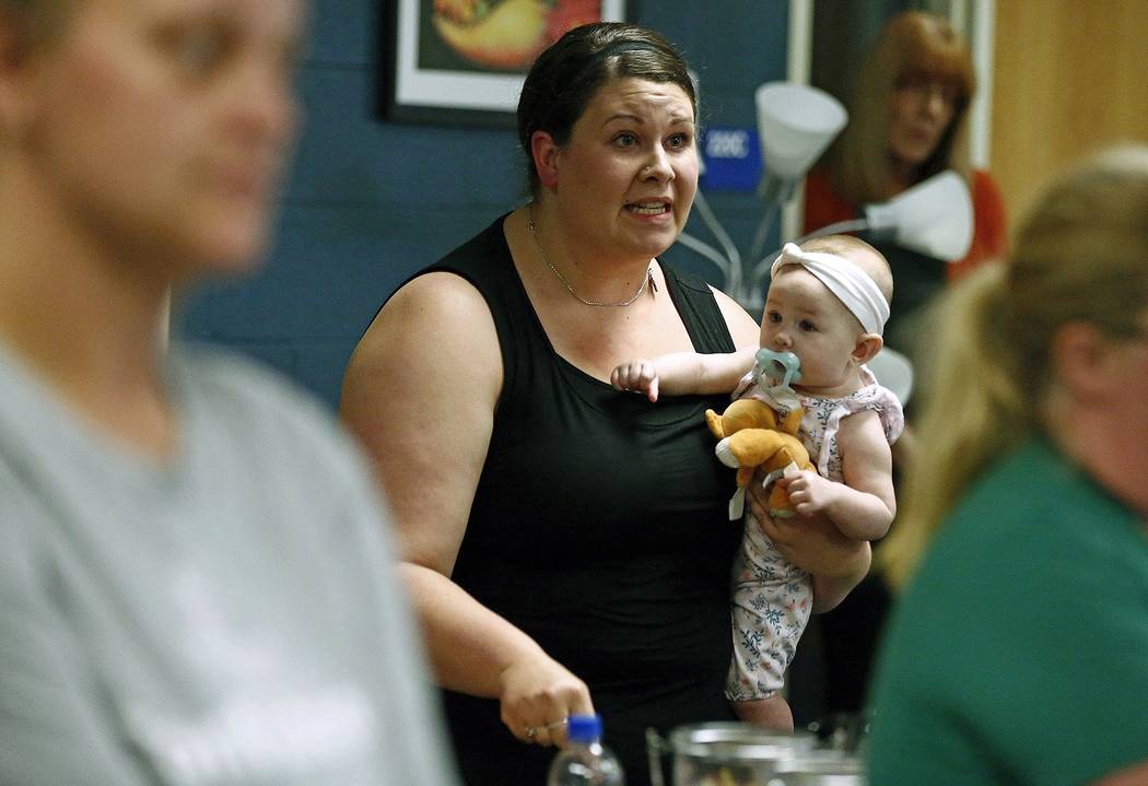 In this Aug. 22, 2019 photo, Jessica Moloney, holding her 6-month-old daughter Amelia, expresse ...