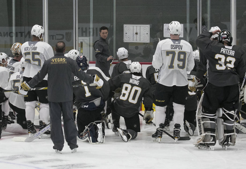 Chicago Wolves coach Rocky Thompson lays out a practice plan for the Vegas Golden Knights durin ...