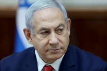 Israeli Prime Minister Benjamin Netanyahu chairs the weekly cabinet meeting, at his office in J ...