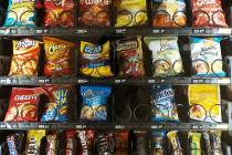 A Sept. 7, 2019, photo shows items in a vending machine in New York. Americans are addicted to ...