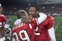 UNLV kicker/punter Ray Cheetany, left, gets a hug from quarterback Jason Thomas in the final mi ...