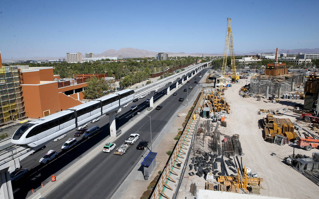 Las Vegas Monorail trains pass the under-construction MSG Sphere performance venue in Las Vegas ...