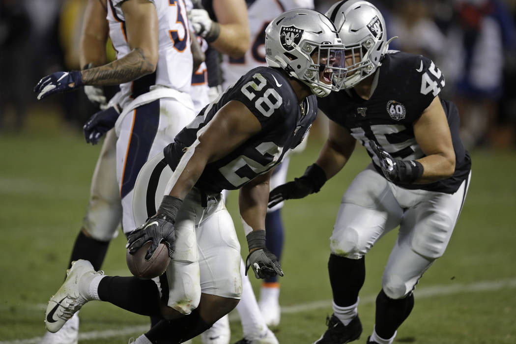 Oakland Raiders running back Josh Jacobs (28) celebrates after scoring a touchdown during the f ...