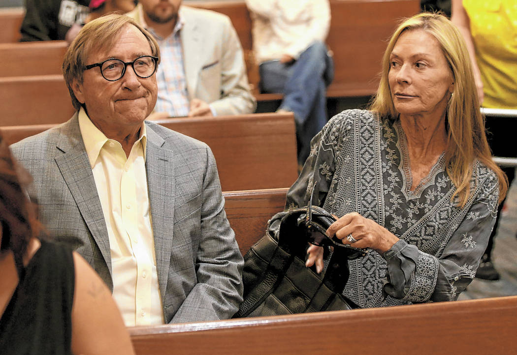 Retired Las Vegas Convention and Visitors Authority CEO Rossi Ralenkotter, left, sits in a cour ...