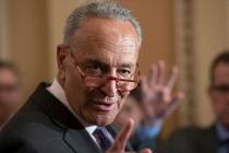 In a July 30, 2019, photo, Senate Minority Leader Chuck Schumer, D-N.Y., takes questions from r ...