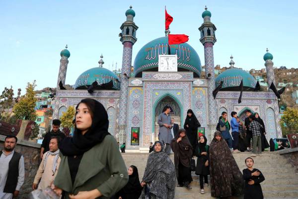 Shiite Muslims visit the Karti Sakhi Shrine a day before Ashoura, in Kabul, Afghanistan, Monday ...