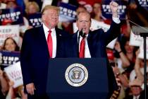 President Donald Trump, left, gives his support to Dan Bishop, right, a Republican running for ...