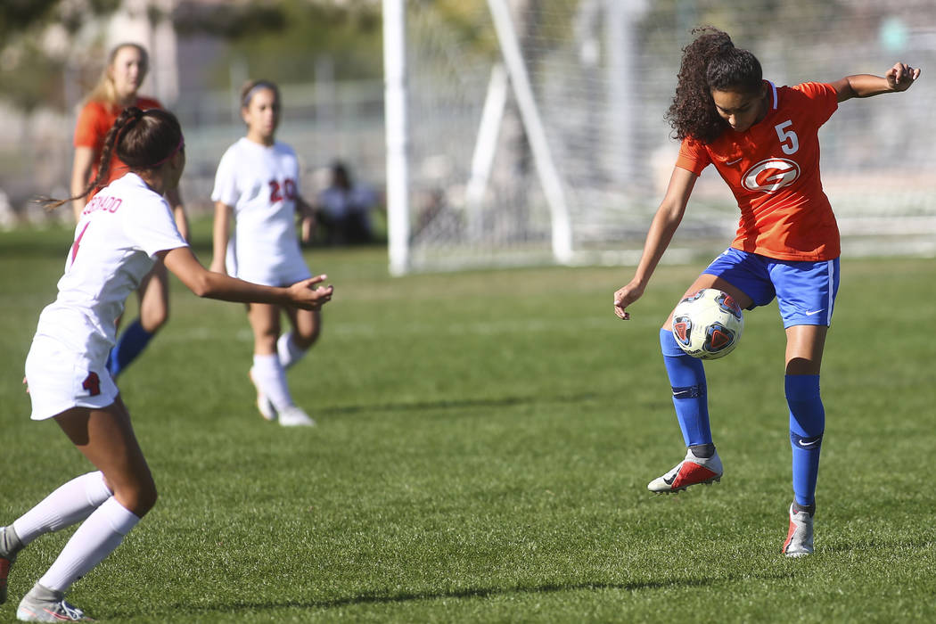 Bishop Gorman's Samantha Nieves (5) kicks the ball past Coronado during the Desert Region girls ...