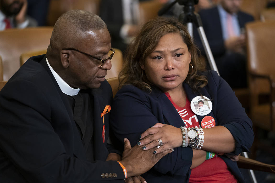 Rev. Jackie Jackson, left, an anti-violence advocate from Cincinnati, and gun violence survivor ...