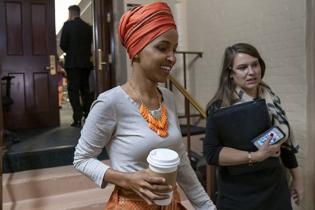 Rep. Ilhan Omar, D-Minn., departs a meeting of the House Democratic Caucus as Congress returns ...