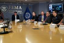 President Donald Trump, left, listens as Kenneth Graham, director of NOAA's National Hurricane ...