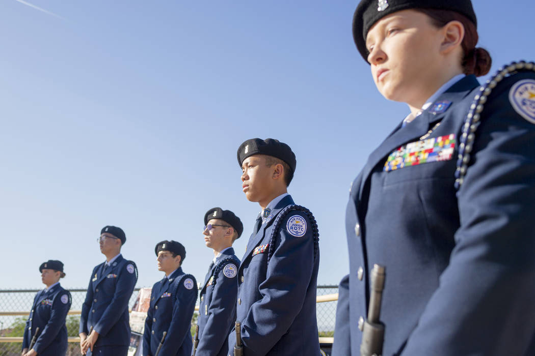Palo Verde High School students in the Air Force JROTC stand in memory of the school's foreign ...