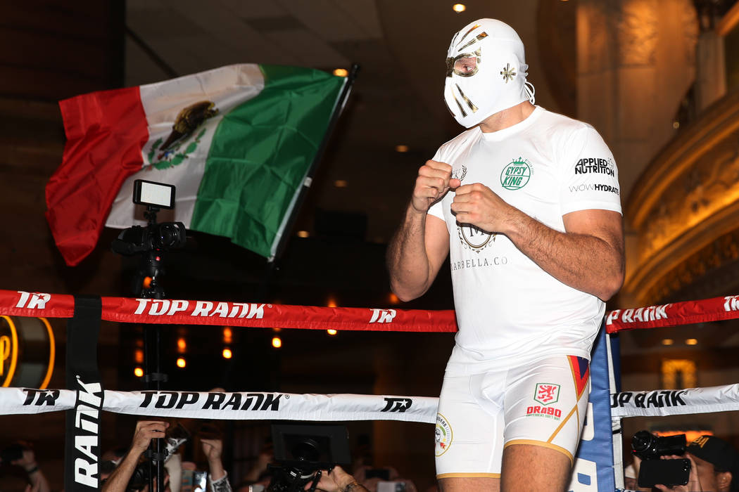 Heavyweight fighter Tyson Fury takes the ring wearing a Mexican wrestling mask during an open w ...