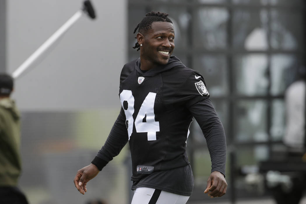 In this Aug. 20, 2019 file photo, Oakland Raiders' Antonio Brown smiles before stretching durin ...