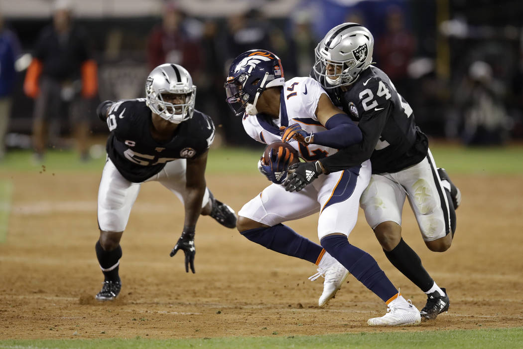 Denver Broncos wide receiver Courtland Sutton is brought down by Oakland Raiders defensive back ...