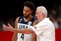 United States' coach Gregg Popovich, right instructs United States' Derrick White during a matc ...