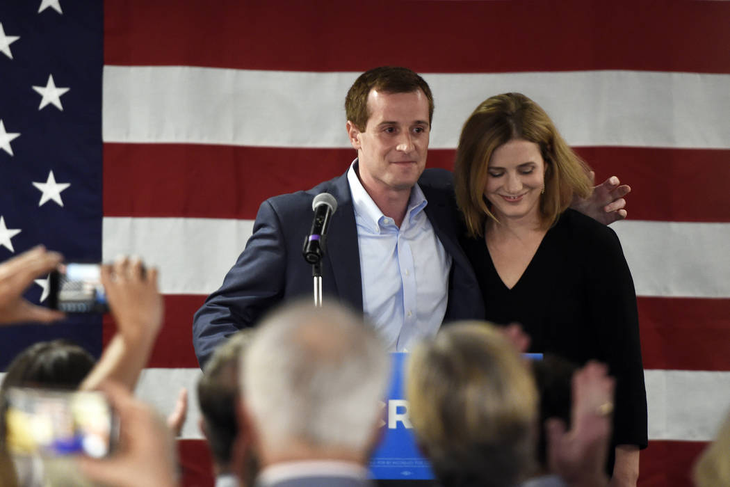 With his wife, Laura by his side, Democrat Dan McCready greets supporters after losing a specia ...