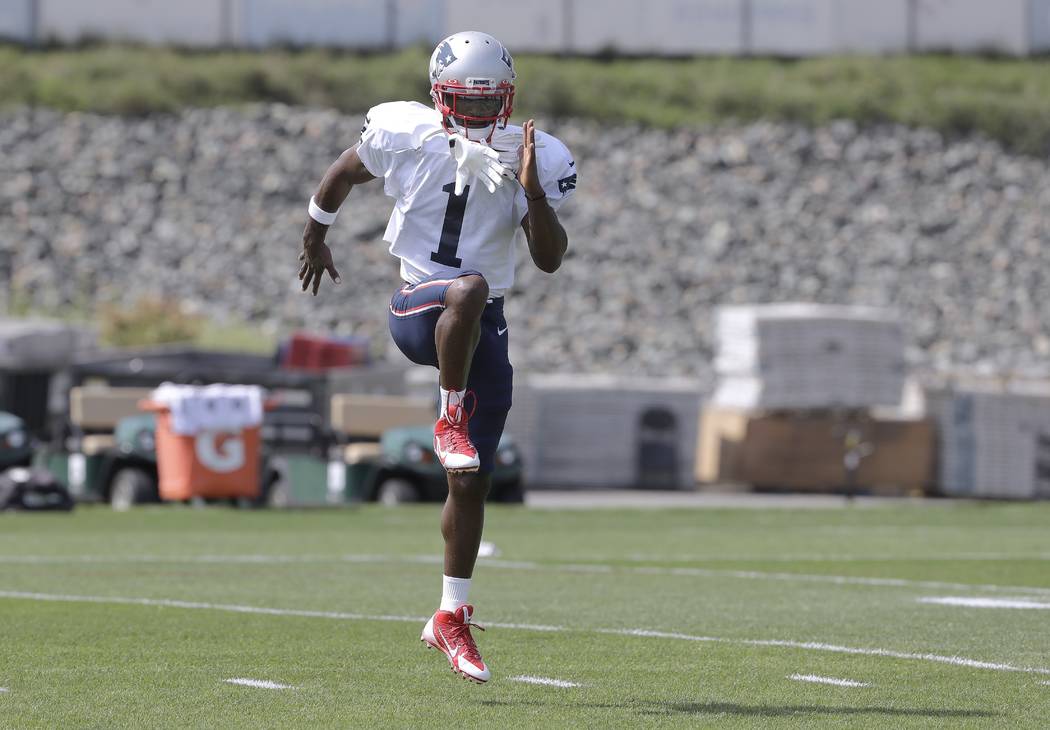 New England Patriots wide receiver Antonio Brown works out during NFL football practice, Wednes ...