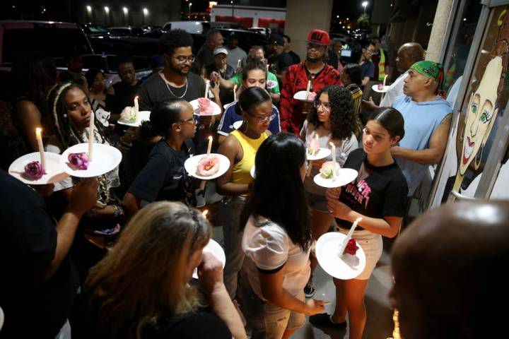 Mourners gather during a vigilon Aug. 30, 2019, at TC's World Famous Rib Crib in Las Vegas for ...
