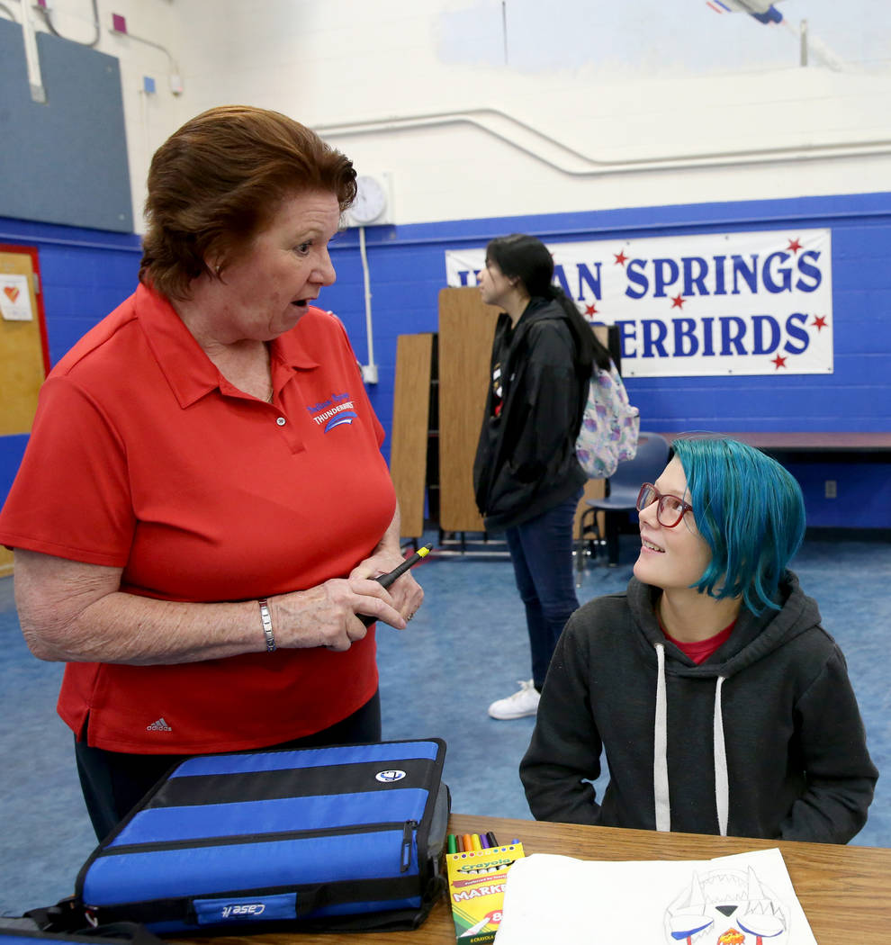 Dottie Frank, an administrative school secretary at Indian Springs School, visits with sixth gr ...