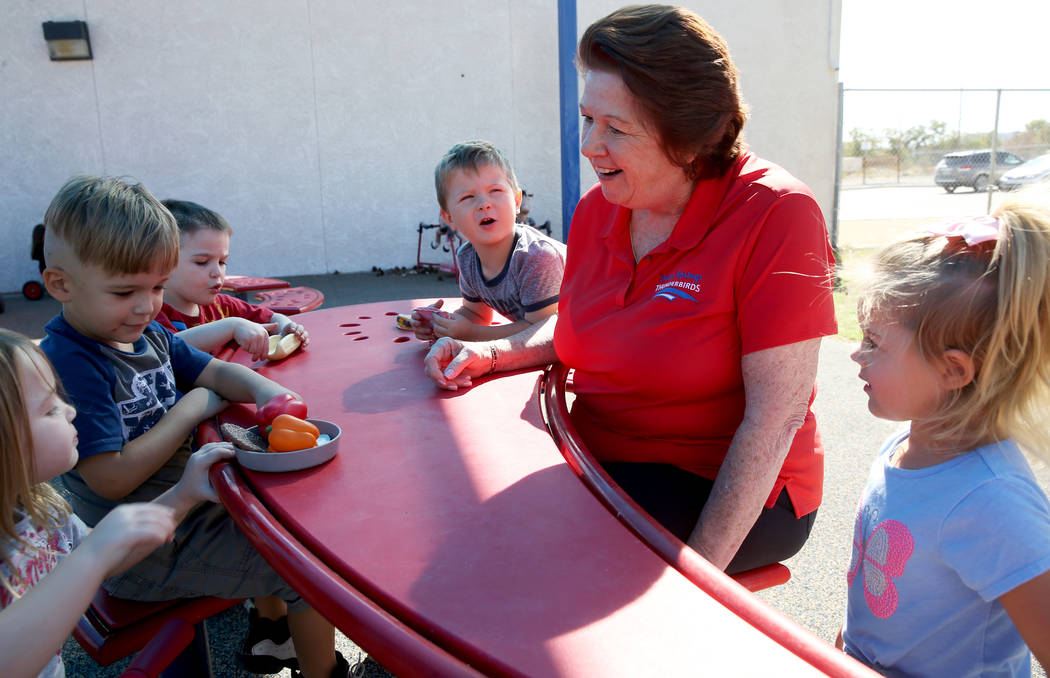 Dottie Frank, an administrative school secretary at Indian Springs School, visits with pre-kind ...