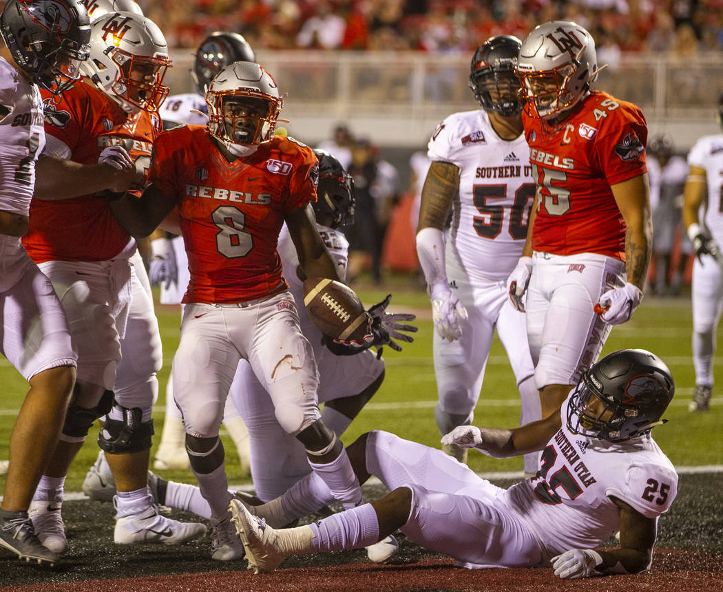 UNLV Rebels running back Charles Williams (8) celebrates a touchdown over Southern Utah at Sam ...