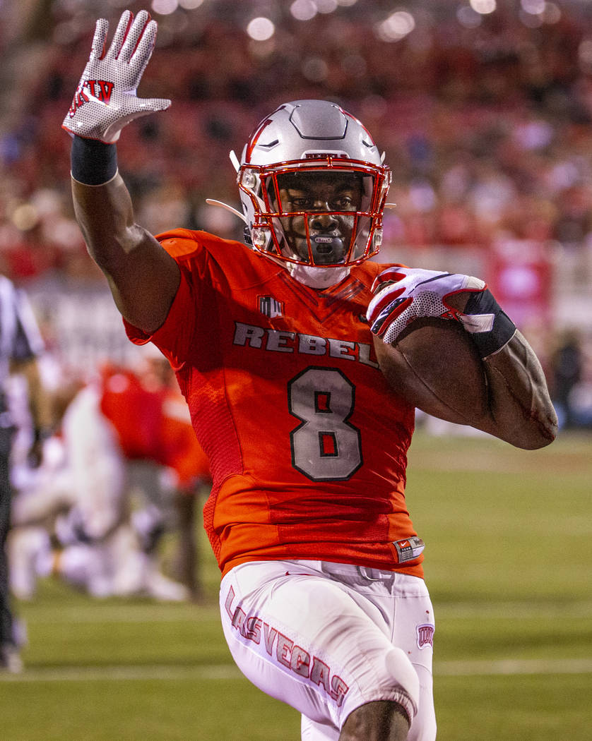 UNLV Rebels running back Charles Williams (8) celebrates a touchdown over Southern Utah at Sam ...