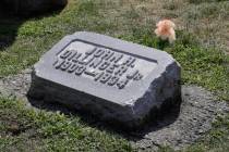 FILE - In this Aug. 1, 2019 file photo, the headstone of John Dillinger is seen at Crown Hill C ...