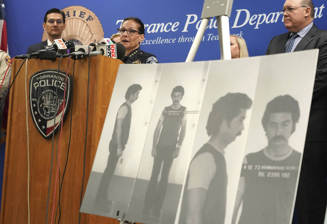 Torrance Police Chief Eve R. Irvine speaks at a press conference in front of a 1972 booking pho ...