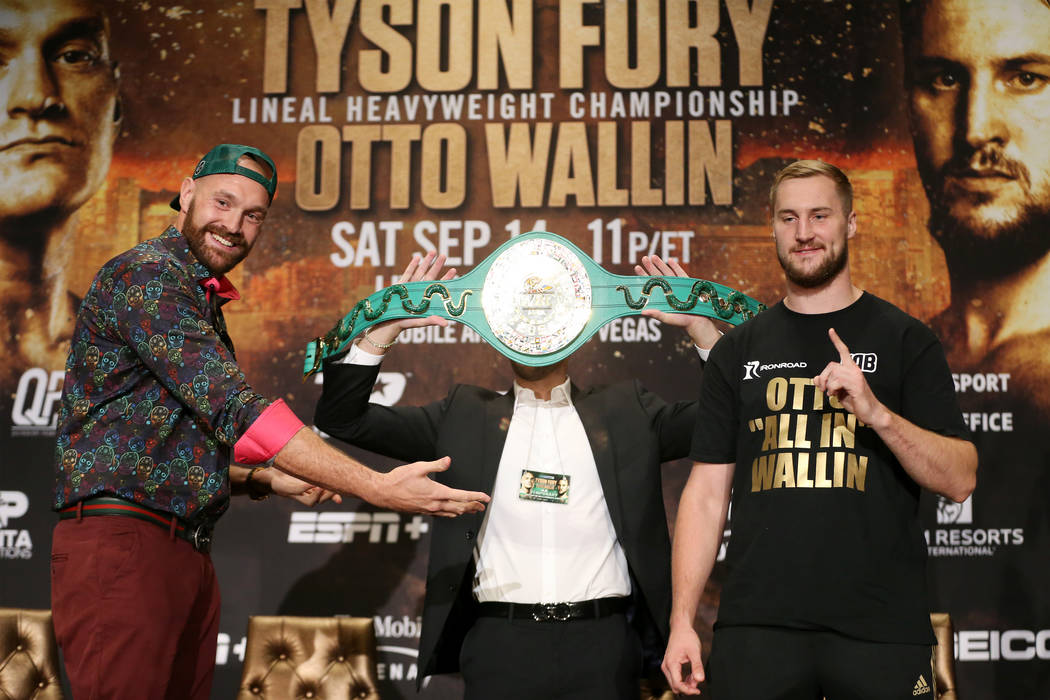 Tyson Fury, left, with Otto Wallin, pose during a press conference at the MGM Grand hotel-casin ...