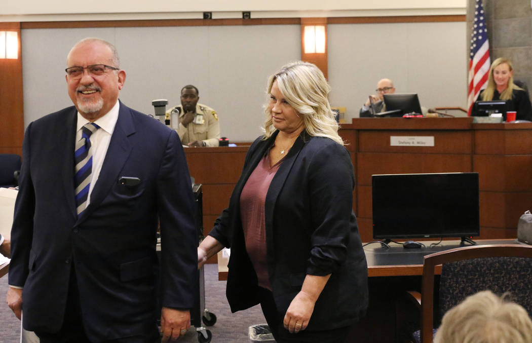 Shelly Calderon and her attorney, Dominic Gentile leave the courtroom after Calderon's initial ...