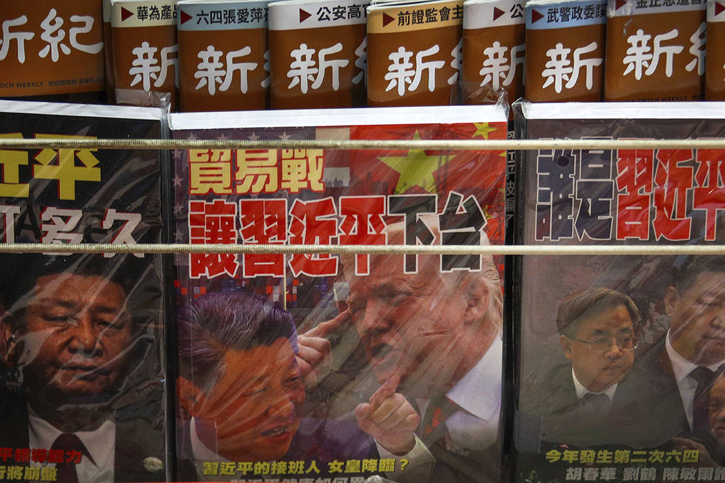 FILE - In this July 4, 2019, file photo, magazines with a front cover featuring Chinese Preside ...