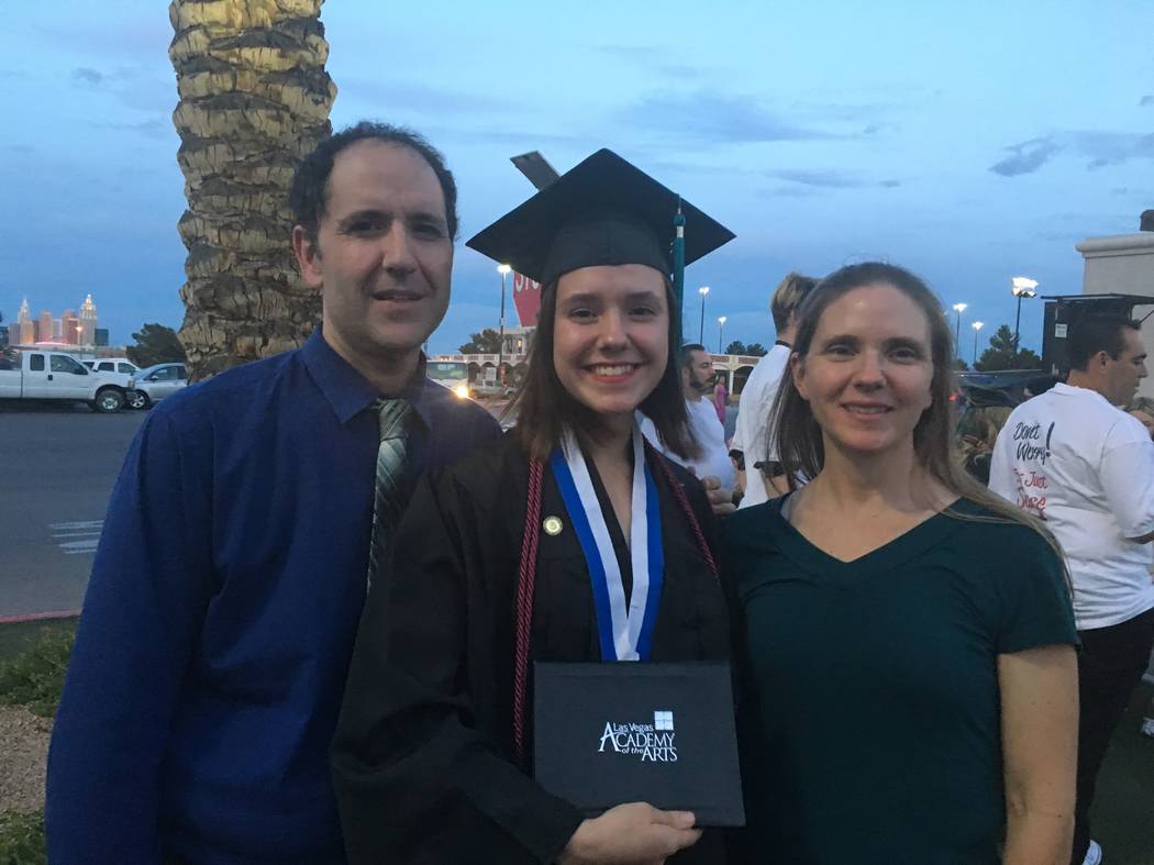 Paula Davis on the day of her high school graduation with her father, Sean, and mother, Kara. S ...