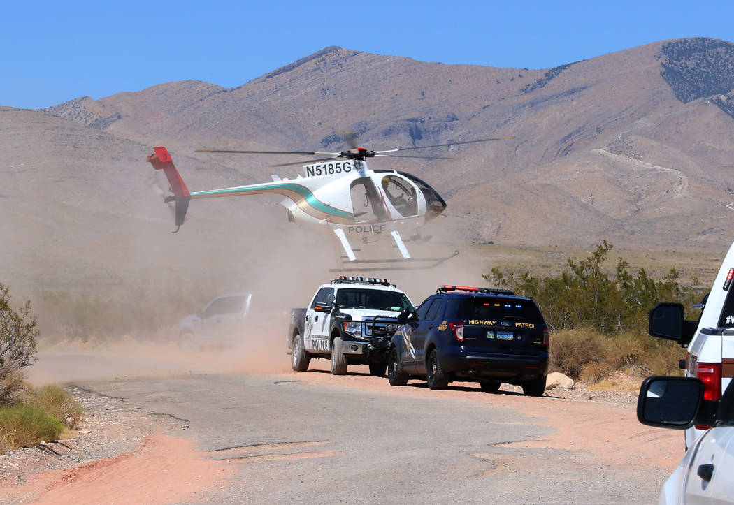 A Metro police helicopter lands near Goodsprings, southwest of Las Vegas, where a hot air ballo ...