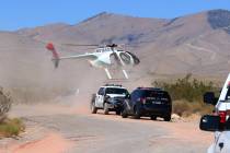 A Metro police helicopter lands near Goodsprings, southwest of Las Vegas, where a hot air ballo ...