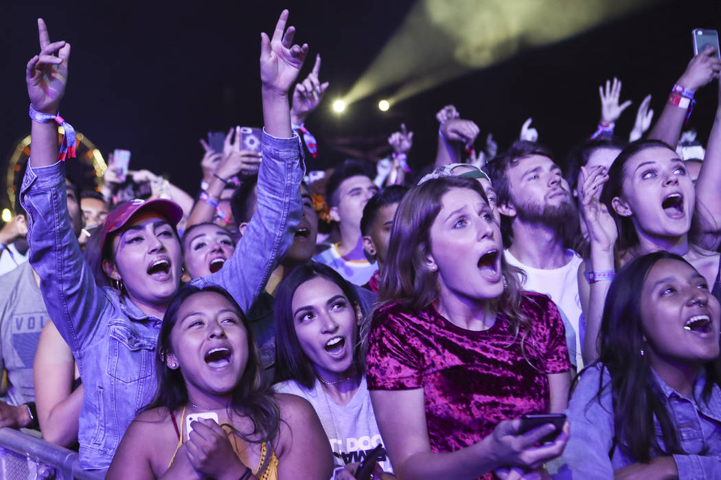Fans react as Chance the Rapper performs on the first day of the Life is Beautiful festival in ...